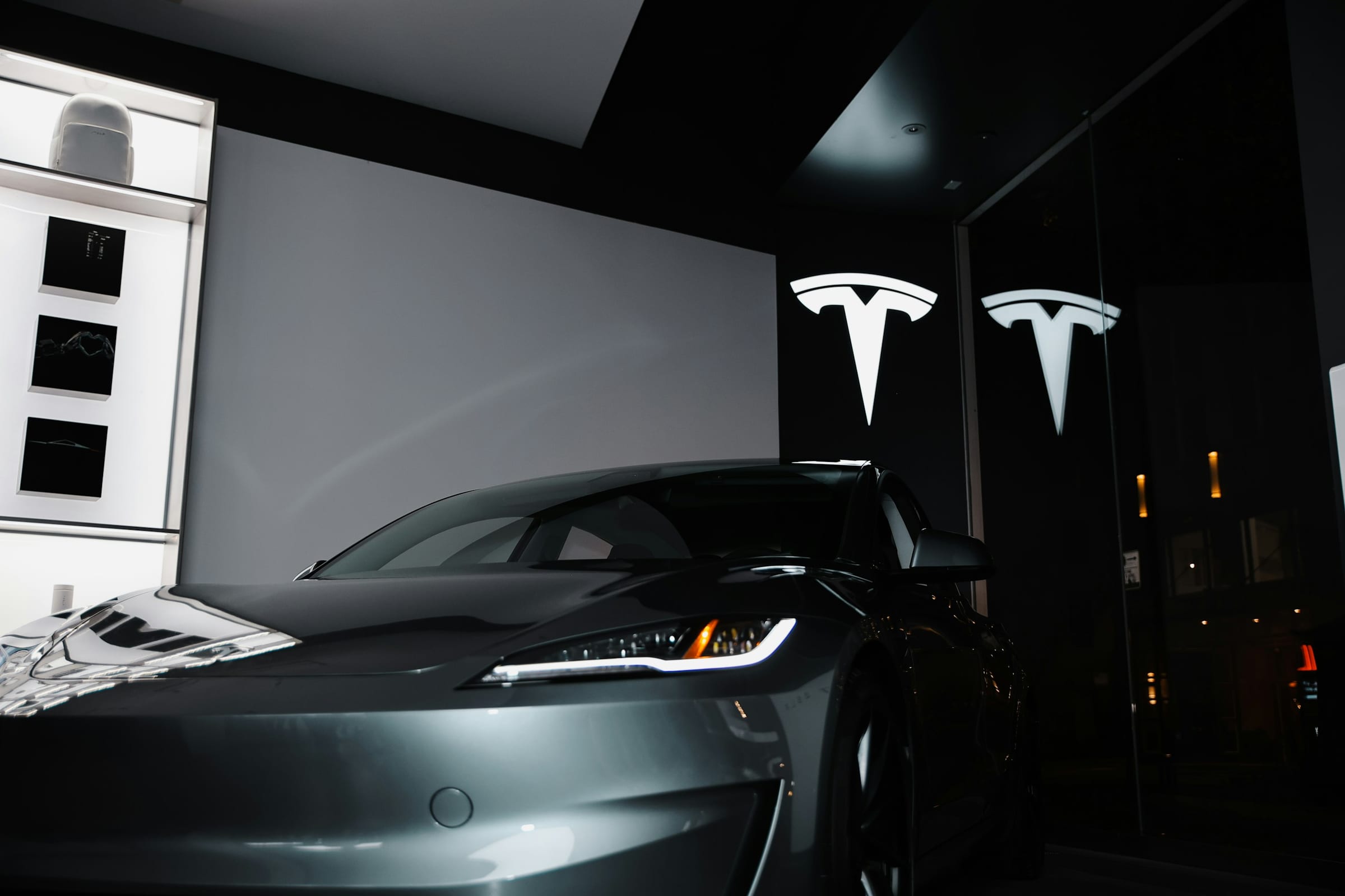 Next-generation Tesla Roadster prototype in a showroom at night